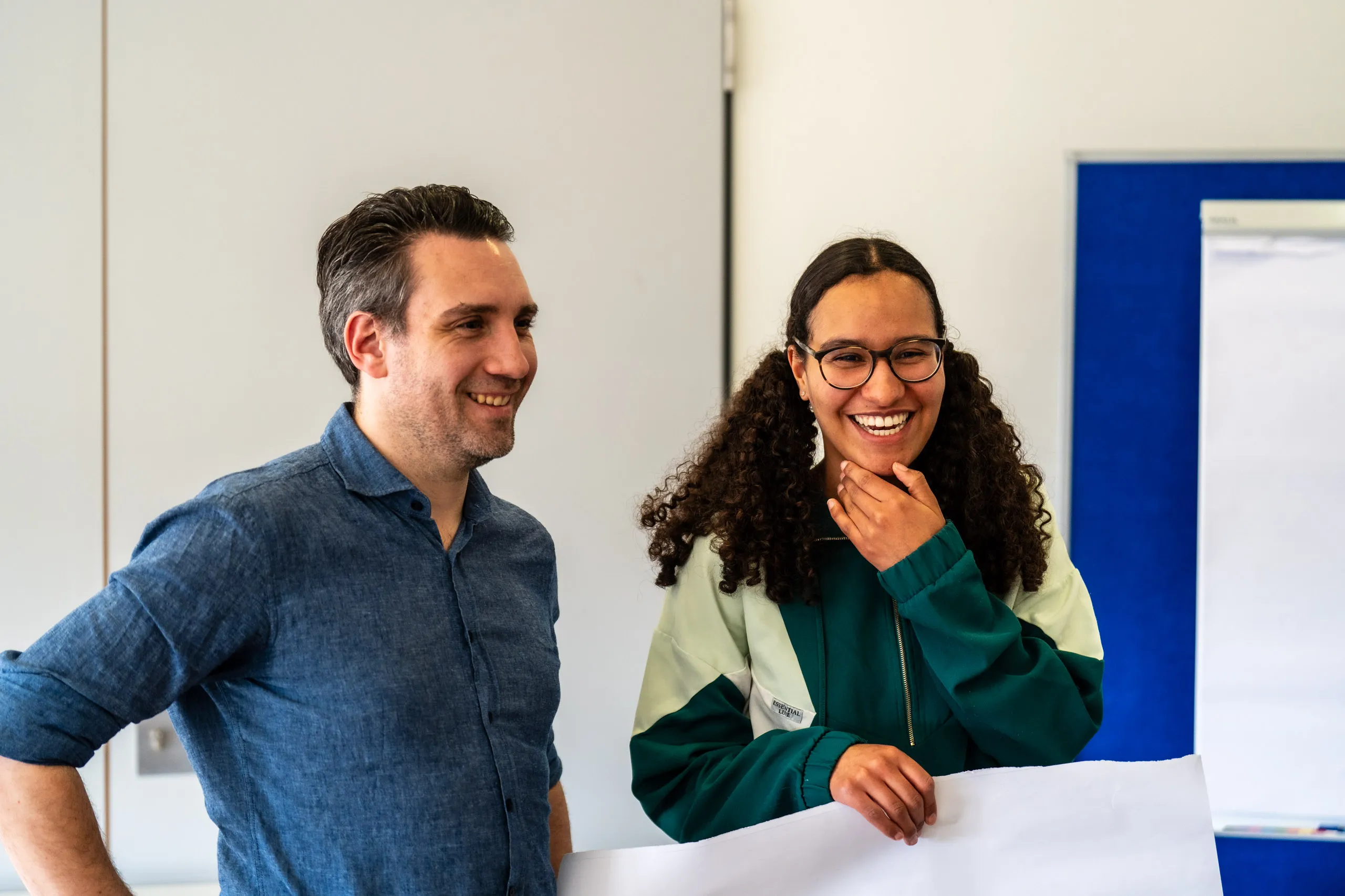 Daniel Musizza and a colleague from the association laughing together during the workshop.